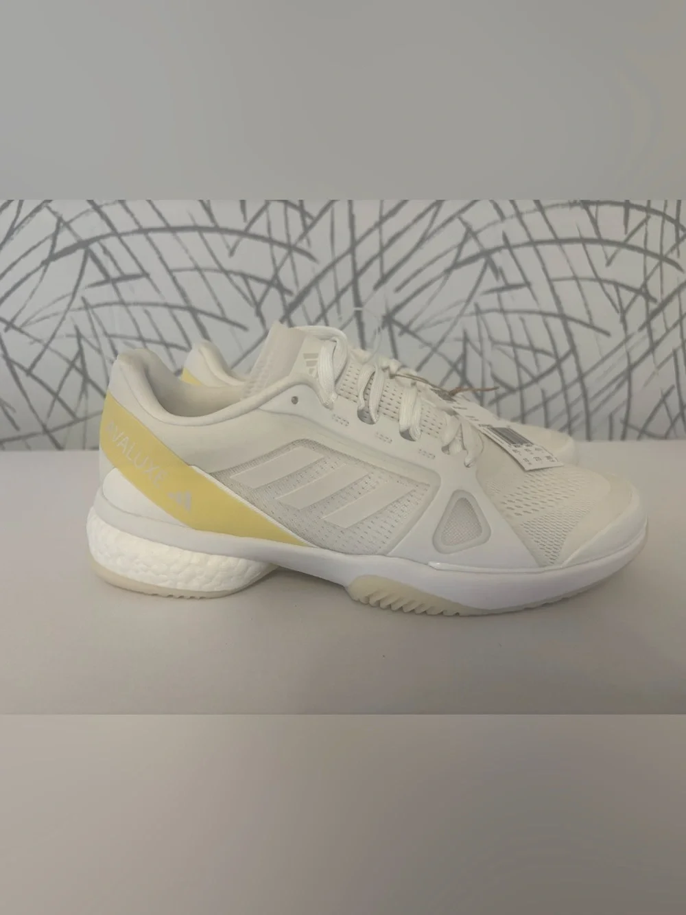 adidas Avaluxe tennis shoes in white with subtle pastel yellow accents. JQ7080